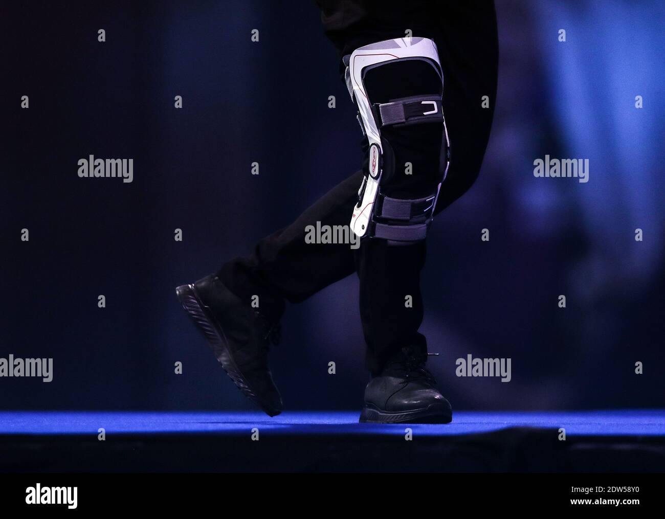 General view of Dimitri Van den Bergh's knee brace while dancing during day eight of the William Hill World Darts Championship at Alexandra Palace, London. Stock Photo