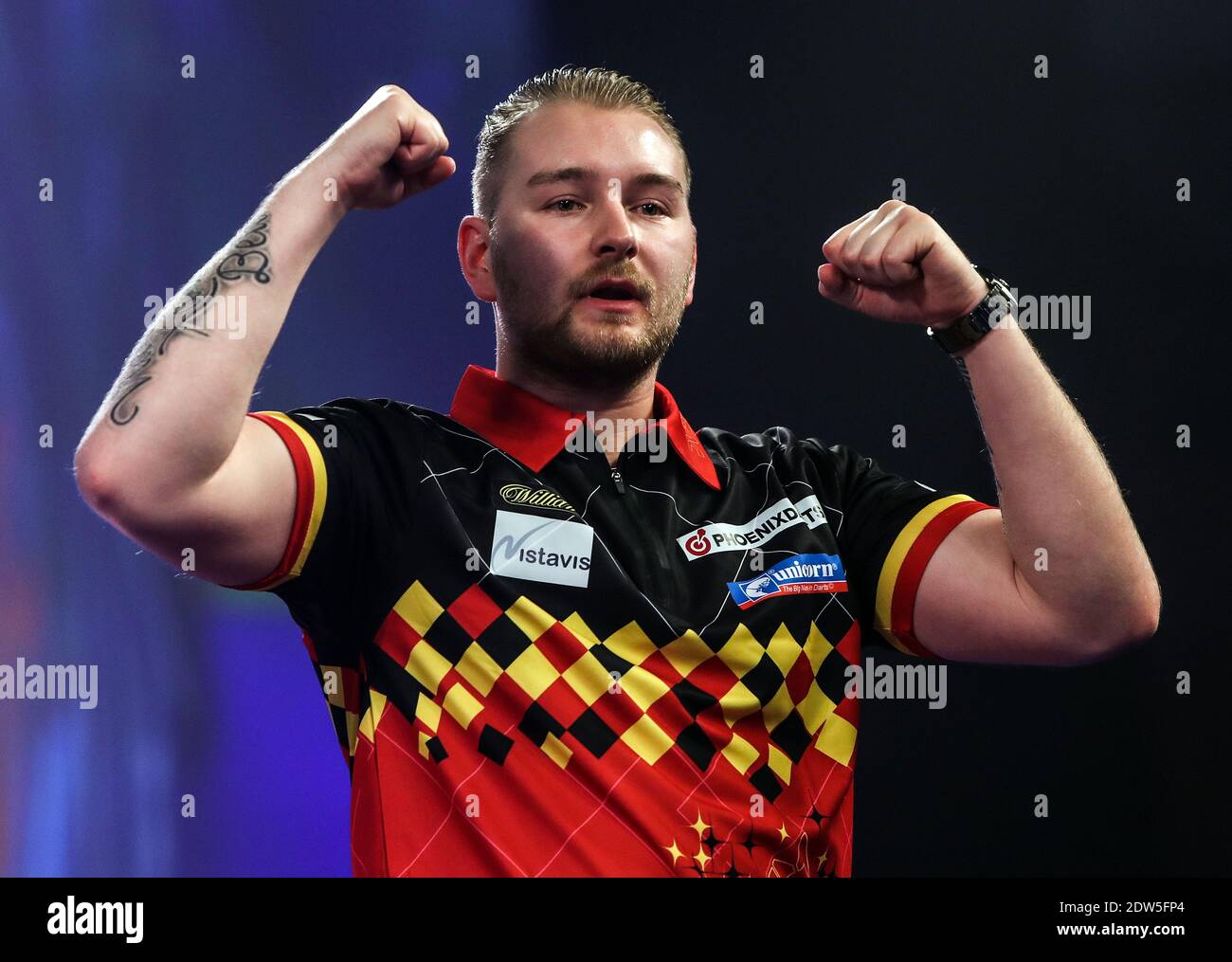 Dimitri Van den Bergh celebrates after beating Paul Lim during day