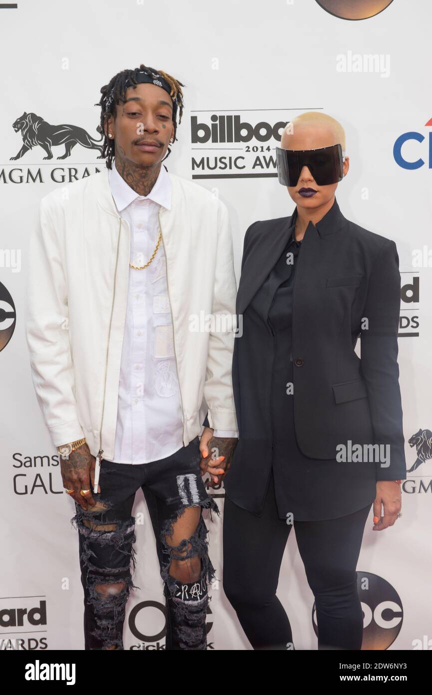 Rapper Wiz Khalifa (L) and model Amber Rose attend the 2014 Billboard ...