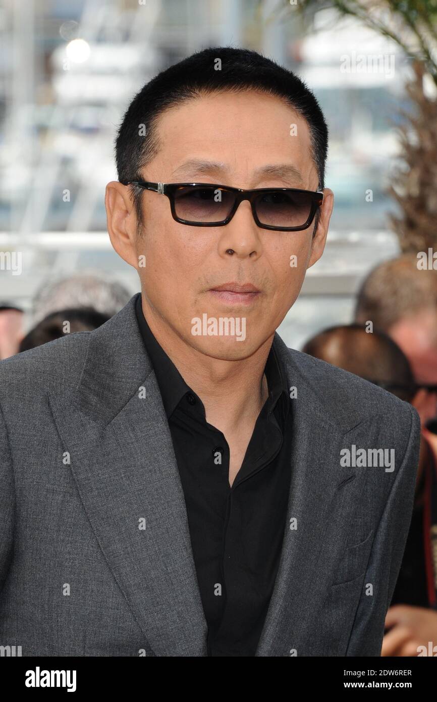 Daoming Chen posing at Coming Home photocall held at the Palais Des ...