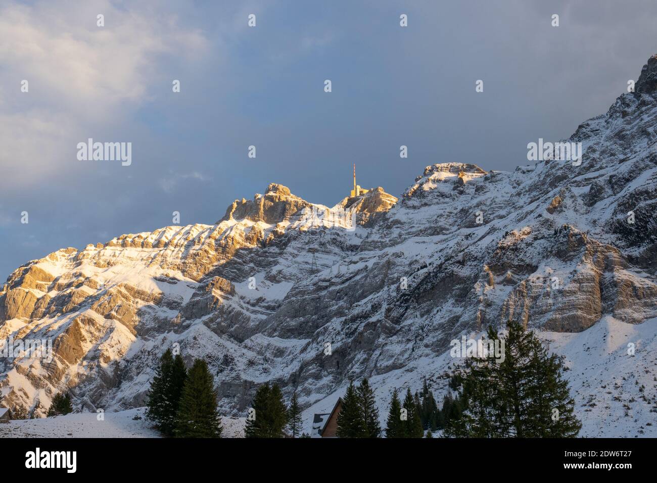 Afternoon view into the snow covered rock wall of Saentis, a Swiss mountain Stock Photo