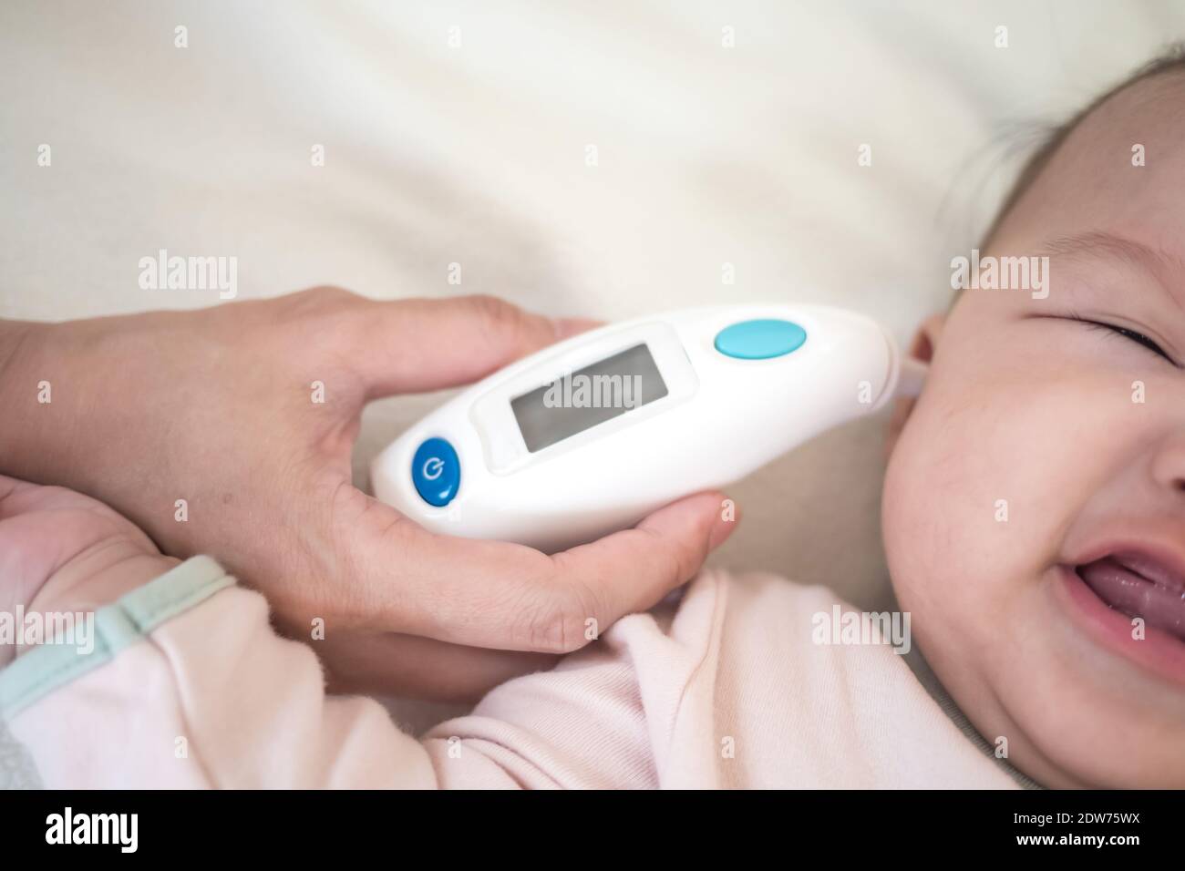 Baby ear temperature hires stock photography and images Alamy