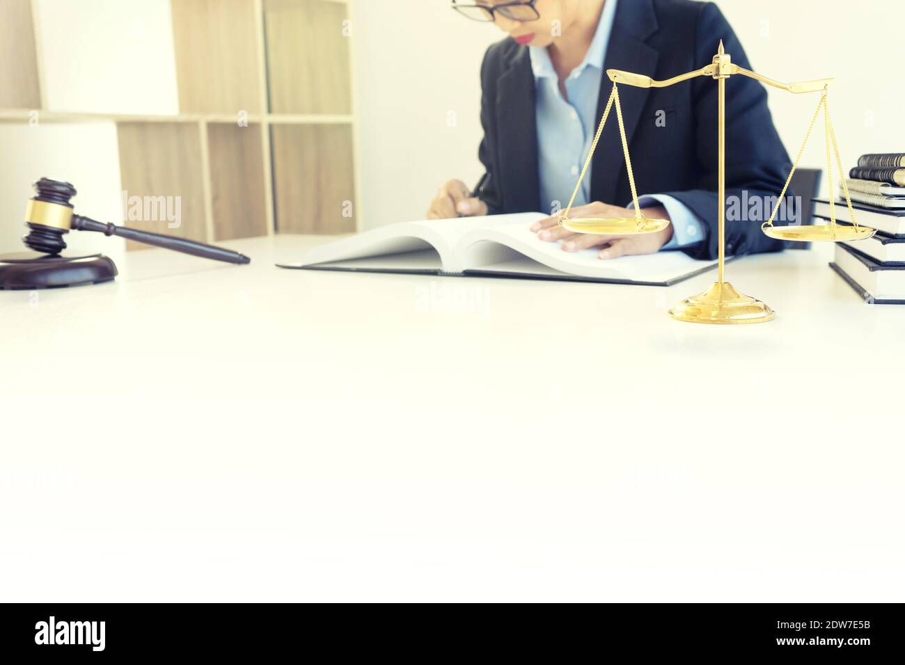 Lawyer Reading Book At Desk In Office Stock Photo Alamy