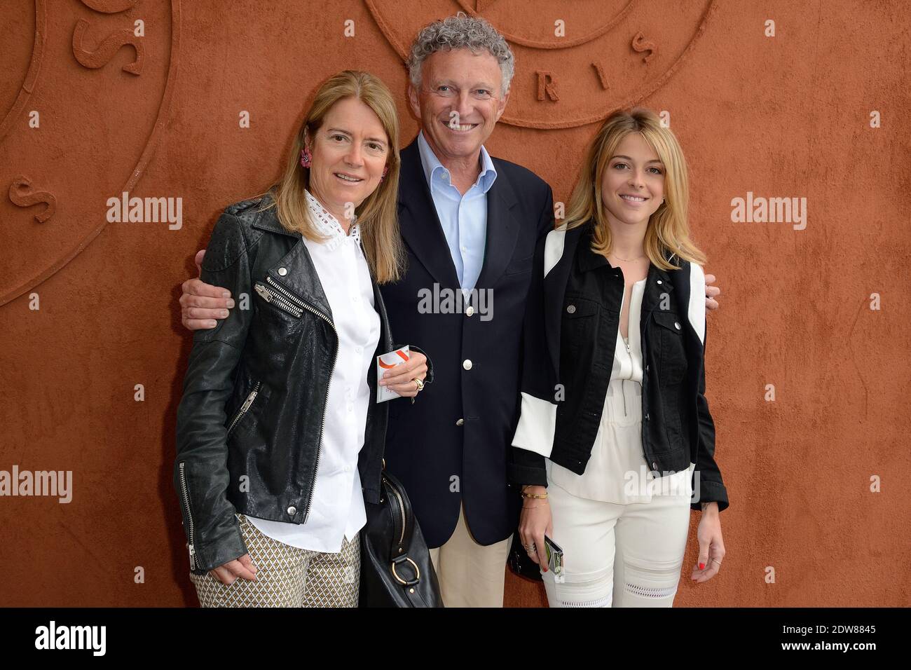 Nelson Monfort with his wife and his daughter Victoria Monfort stopping by  the Village, the VIP quarter of the French Tennis Open 2014 at Roland  Garros arena in Paris, France, on June