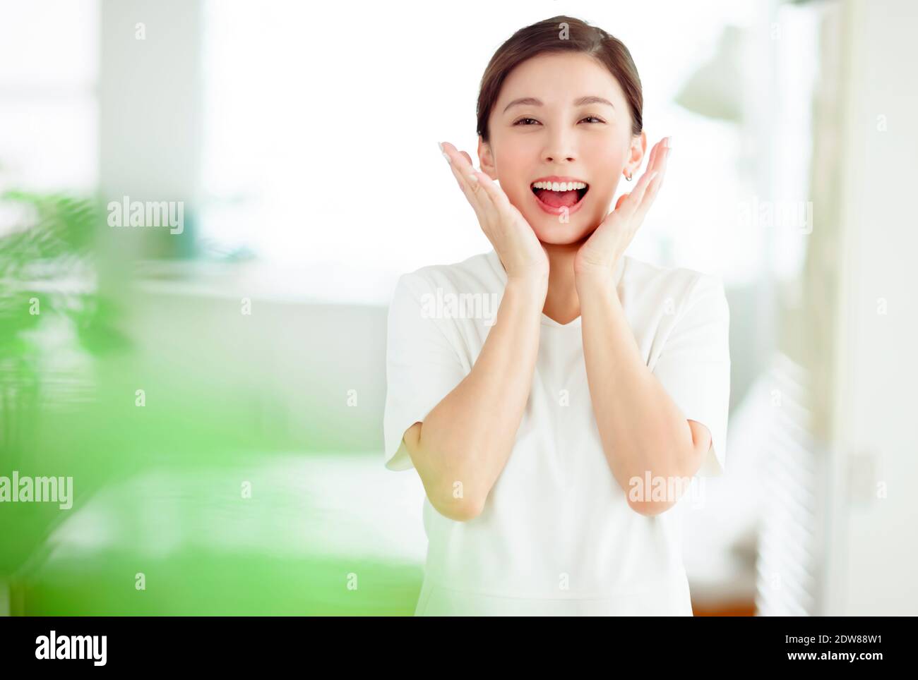 excited young asian woman  with clean fresh healthy skin Stock Photo