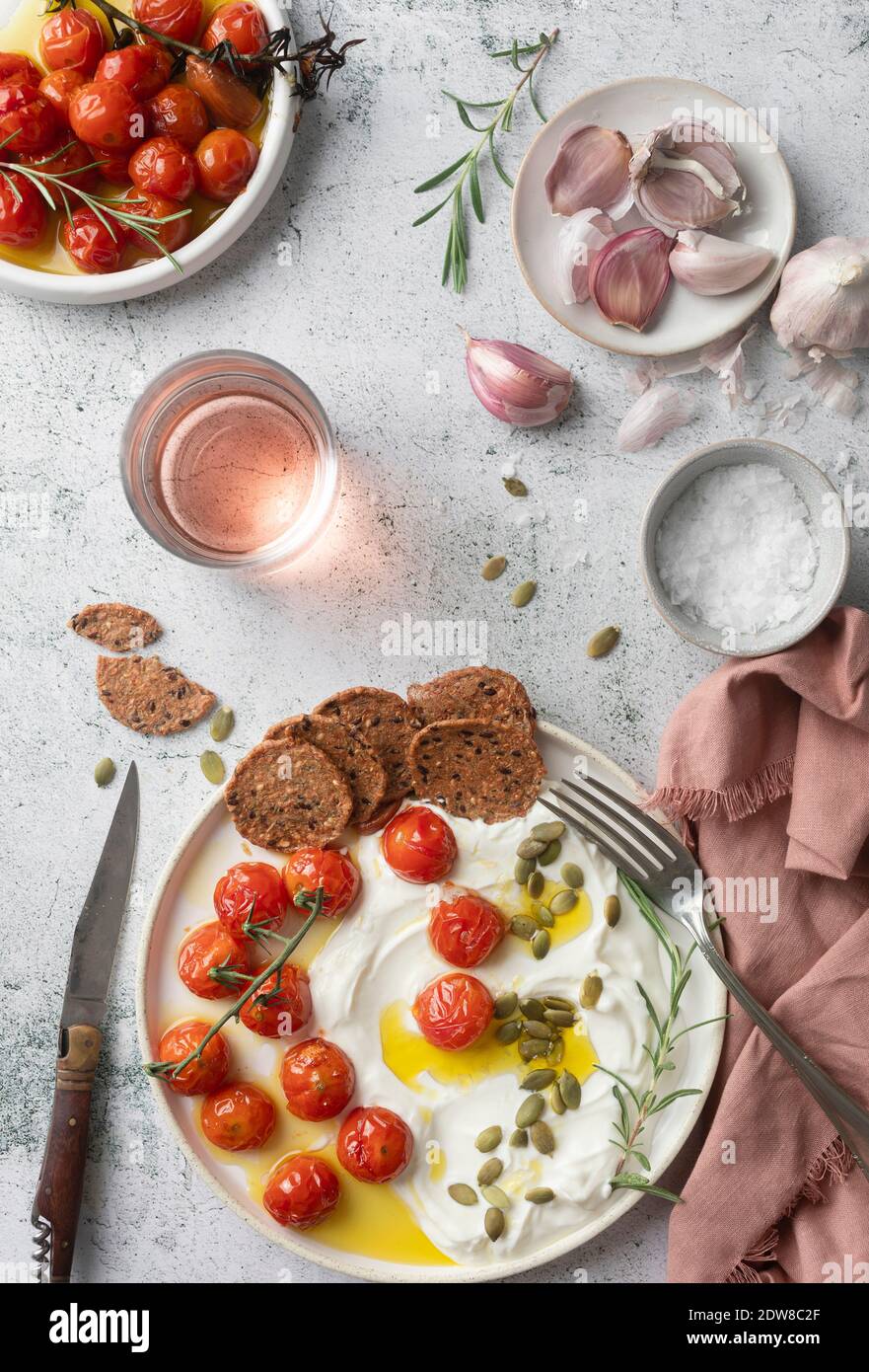 Whipped feta with roasted tomatoes Stock Photo