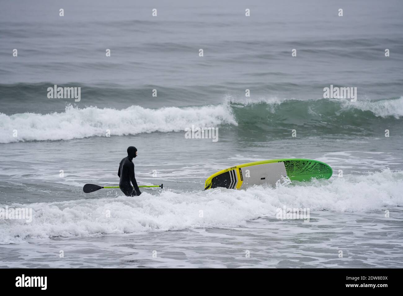 Paddleboarding sport in New Hampshire cold waters winter activities
