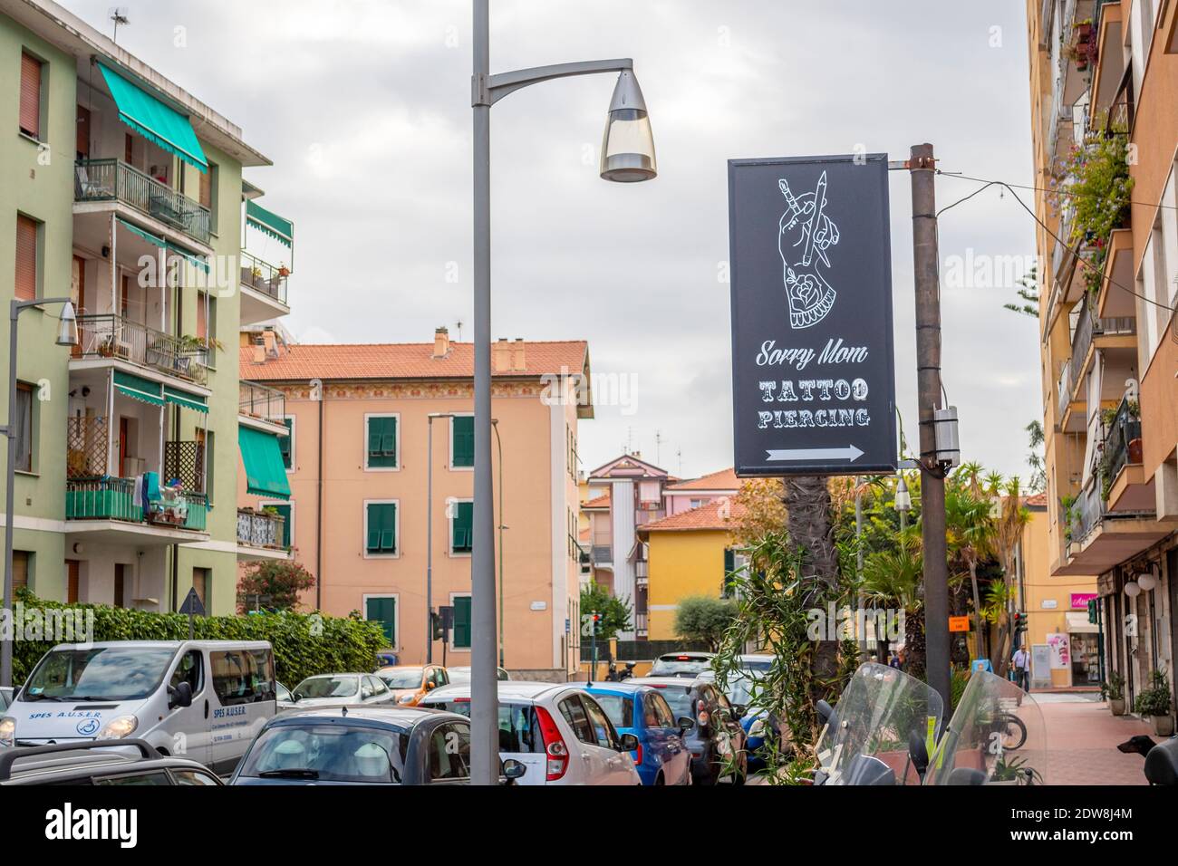 General view of the Sorry Mom tattoo parlor sign under clouds on September 12, 2019 in Ventimiglia, Italy Stock Photo