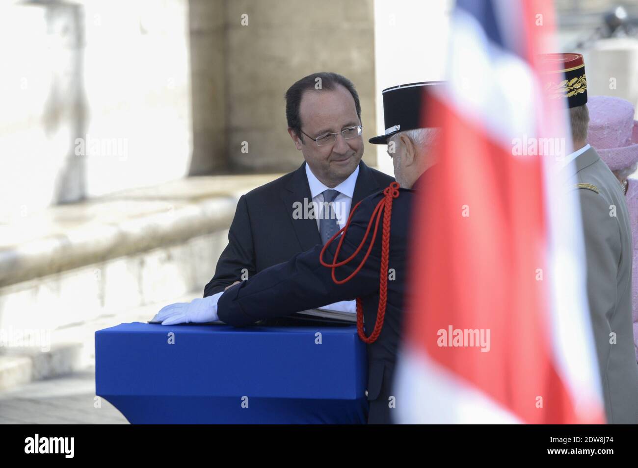 Queen Elizabeth II lays a memorial wreath along with French President Francois Hollande at the Arc de Triomphe during a State visit to France and the celebration of the D-Day 70th anniversary. Paris, France, June 5, 2014. Photo by Gilles Rolle/Pool/ABACAPRESS.COM Stock Photo