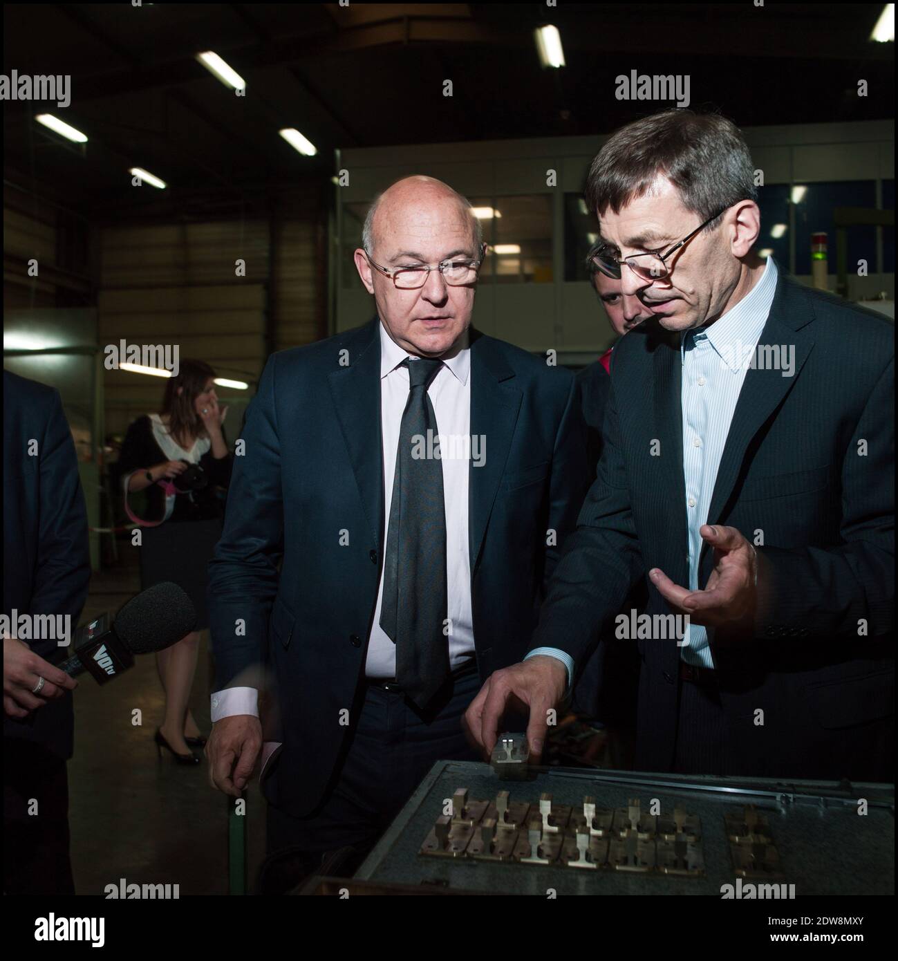 Michel Sapin, flanked by CERPI CEO Louis Ristic , visits CERPI, (company specializing in the manufacture of parts for the aeronautical) in Saint-Ouen-L'Aumone, France on June 5, 2014. Photo by Renaud Khanh/ABACAPRESS.COM Stock Photo