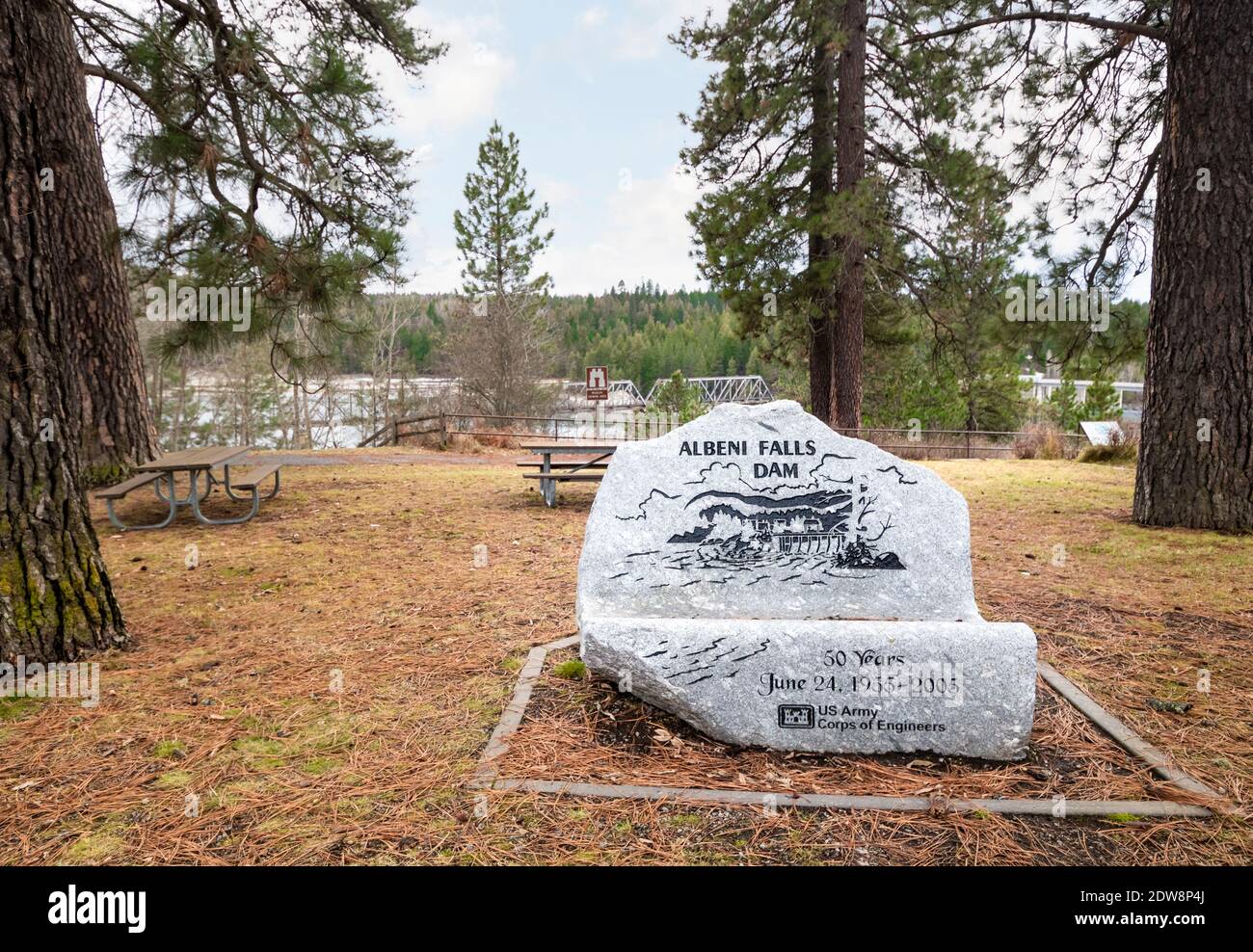 A commemorative boulder representing 50 years of the Albeni Falls dam on the Priest River, near Oldtown and Priest River Idaho, USA. Stock Photo