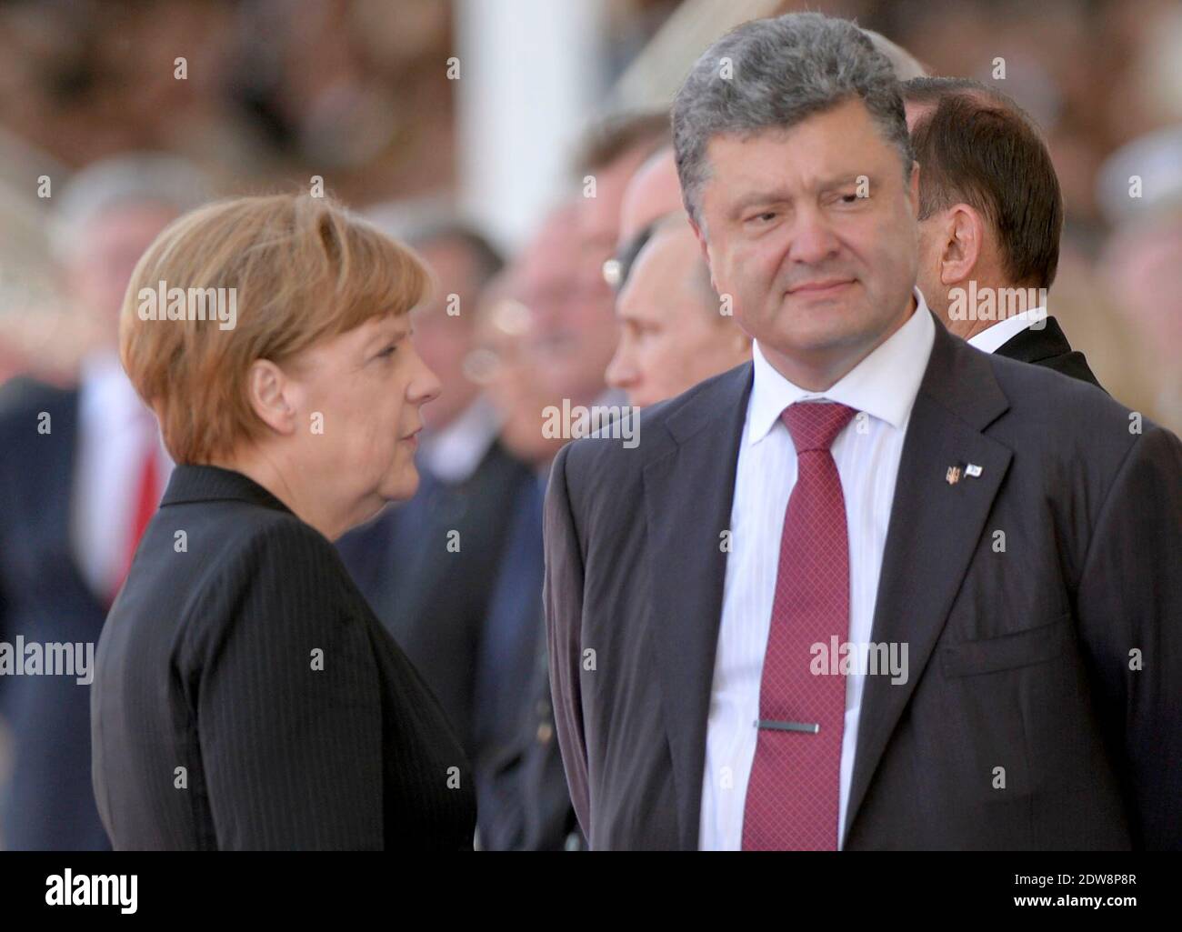 German Chancellor Angela Merkel and President of Ukraine, Petro Oleksiyovytch Porochenko attend the International Ceremony at Sword Beach in Ouistreham, as part of the official ceremonies on the occasion of the D-Day 70th Anniversary, on June 6, 2014 in Normandy, France. Photo by Abd Rabbo-Bernard-Gouhier-Mousse/ABACAPRESS.COM Stock Photo