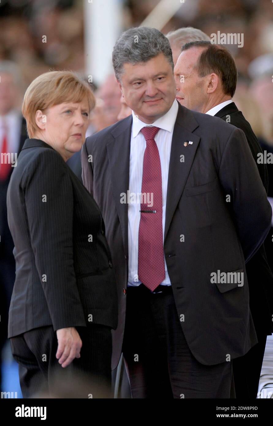 German Chancellor Angela Merkel and President of Ukraine, Petro Oleksiyovytch Porochenko attend the International Ceremony at Sword Beach in Ouistreham, as part of the official ceremonies on the occasion of the D-Day 70th Anniversary, on June 6, 2014 in Normandy, France. Photo by Abd Rabbo-Bernard-Gouhier-Mousse/ABACAPRESS.COM Stock Photo