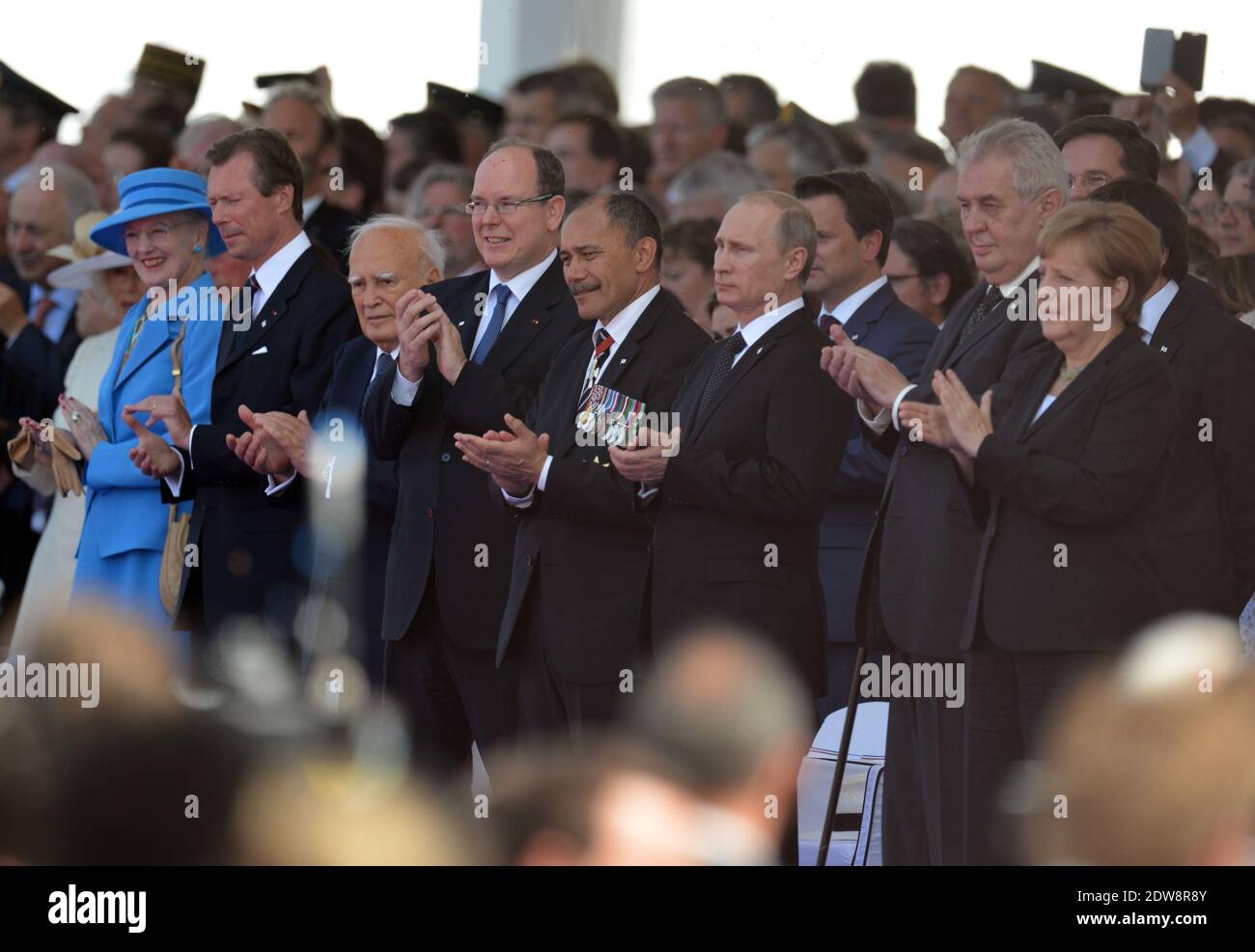 HM the Queen of Denmark, Margrethe II ; HRH The Grand Duke of Luxembourg, Henri ; Karolos Papoulias, President of Greece ; Prince Albert II of Monaco ; Jerry Mateparae, Governor General of New Zealand ; Vladimir Putin, President of Russia ; Milos Zeman, President of the Czech Republic ; Angela Merkel attend the International Ceremony at Sword Beach in Ouistreham, as part of the official ceremonies on the occasion of the D-Day 70th Anniversary, on June 6, 2014 in Normandy, France. Photo by Abd Rabbo-Bernard-Gouhier-Mousse/ABACAPRESS.COM Stock Photo