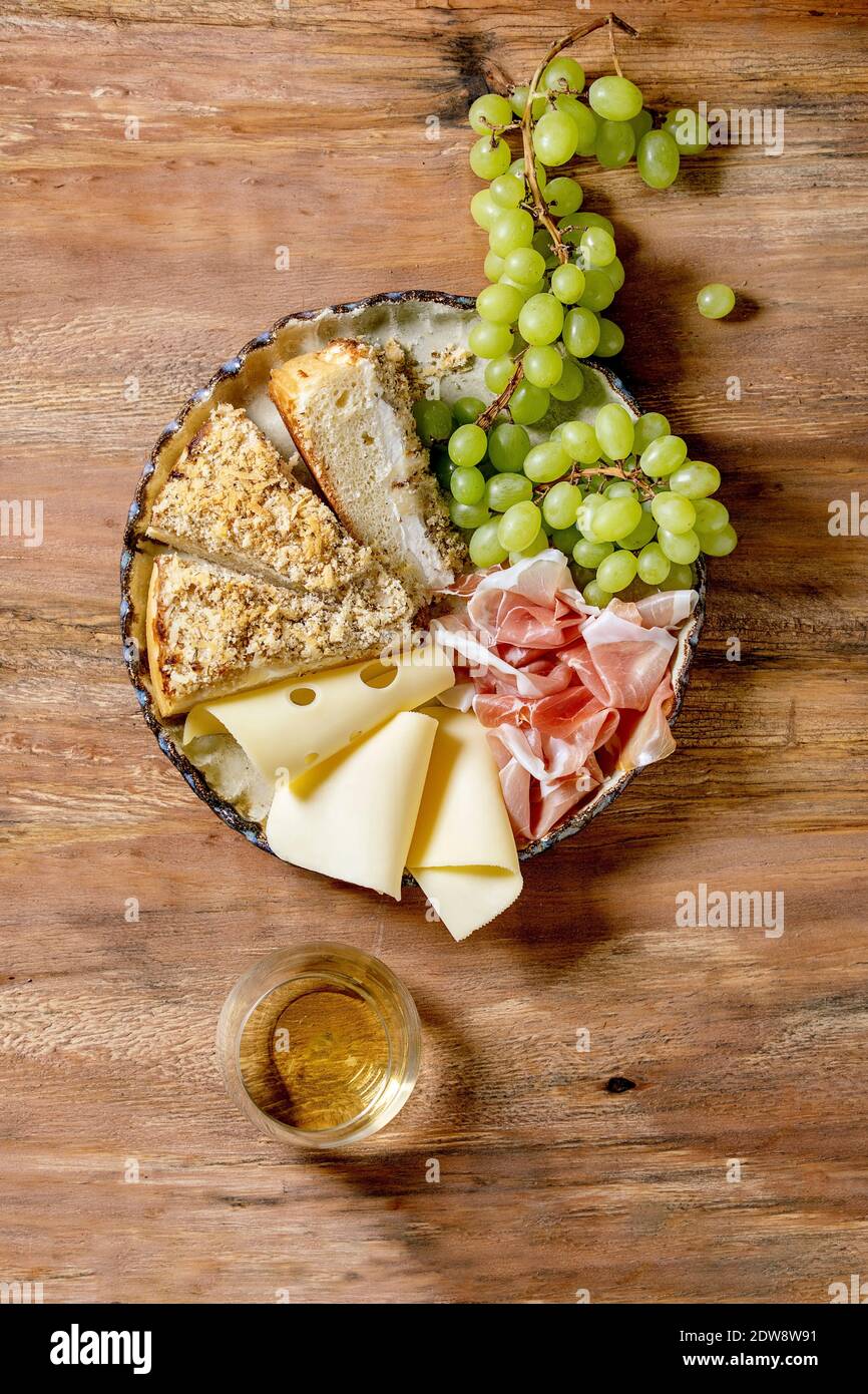 Appetizers antipasti with white sicilian focaccia. Traditional bread