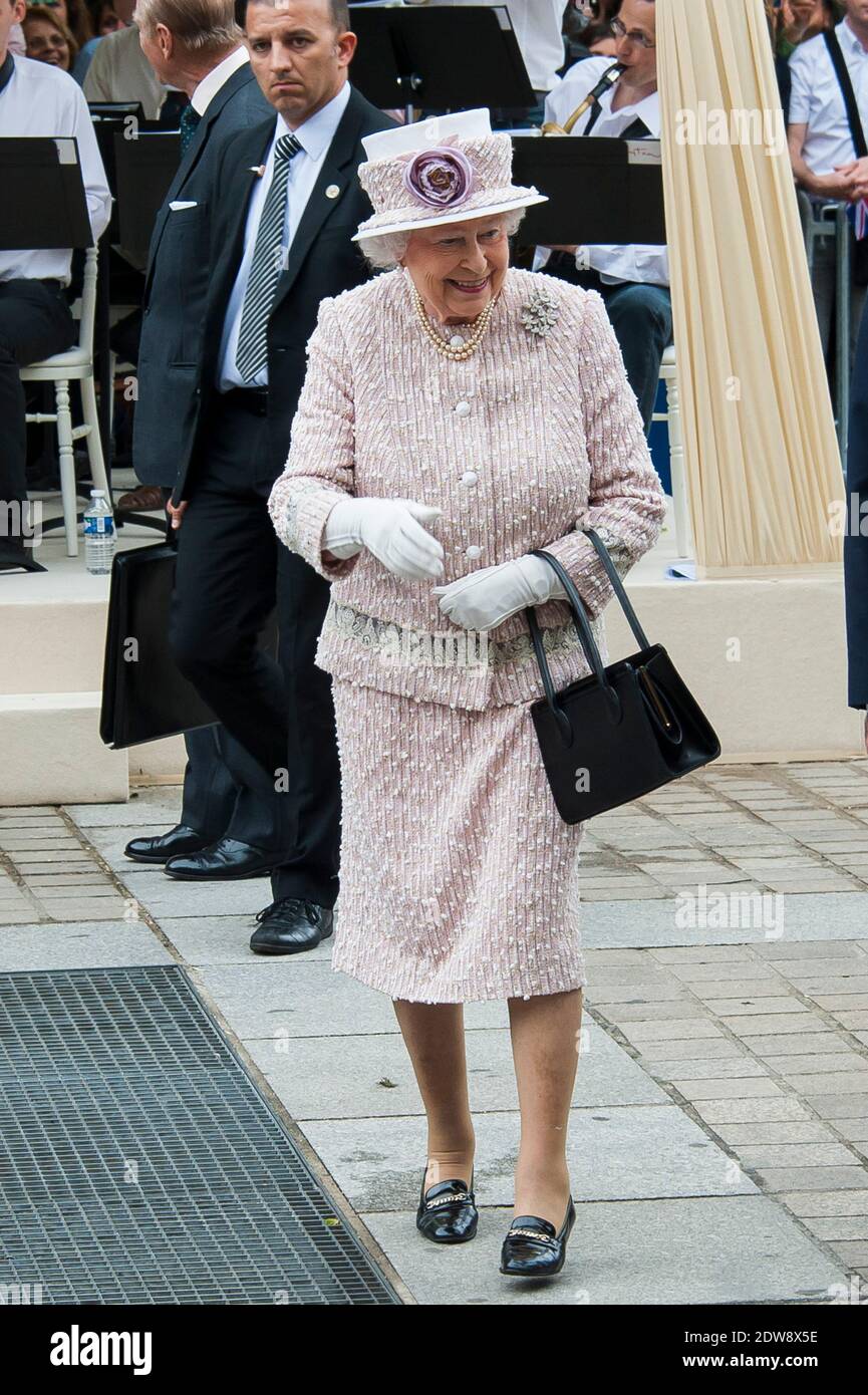 Queen Elizabeth II as she walks around the flower market to Marche aux Fleurs Reine Elizabeth