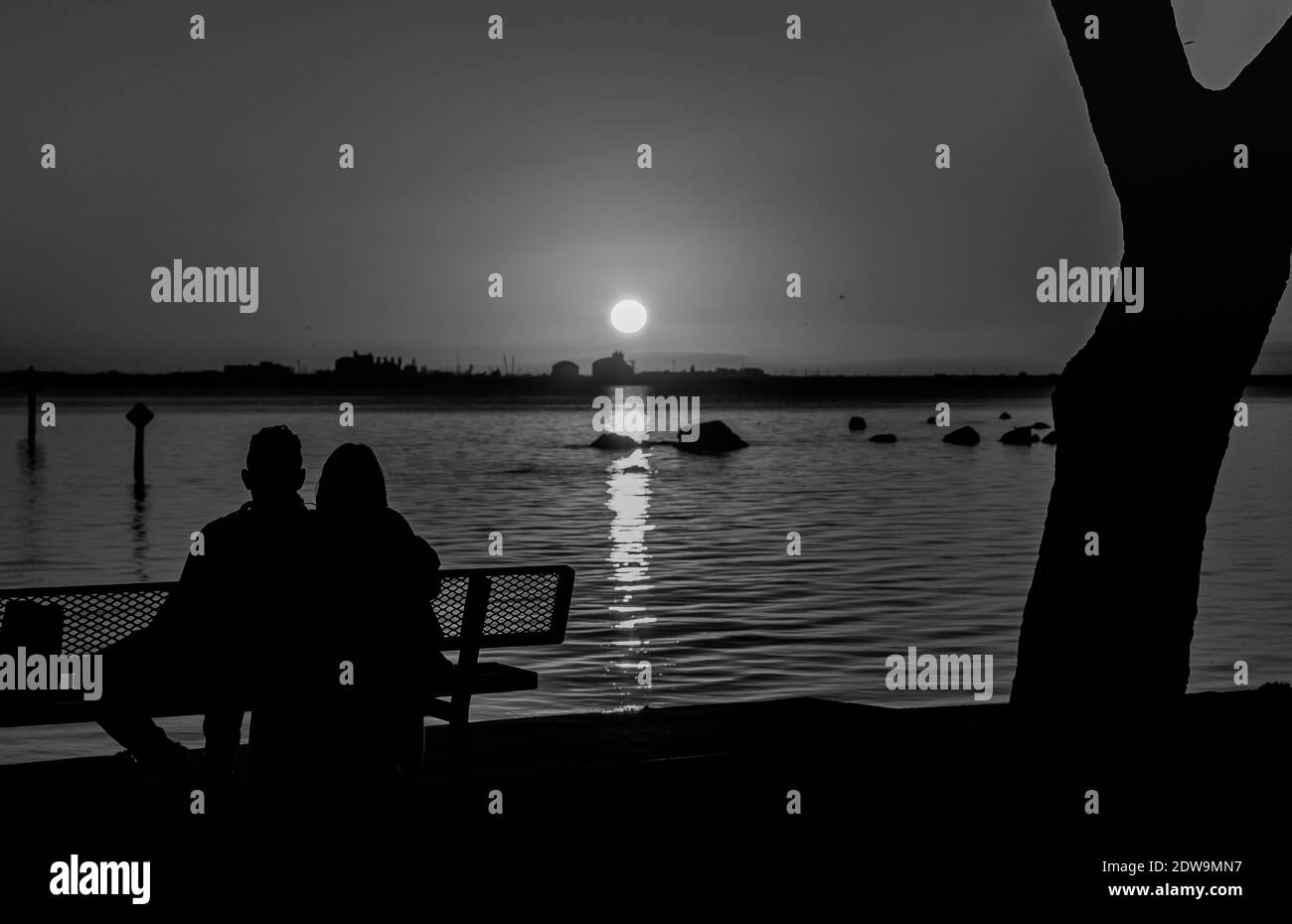 Silhouette Couple Sitting On Bench High Resolution Stock Photography ...