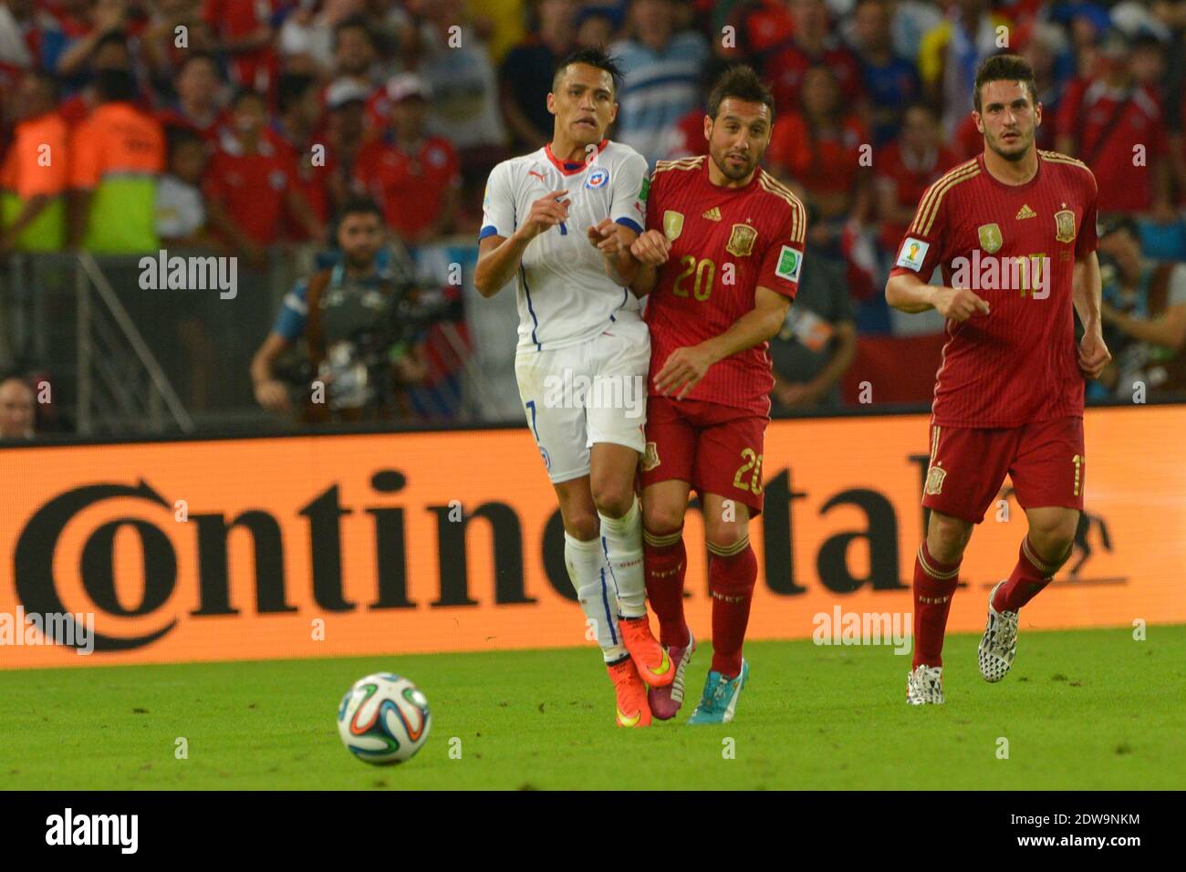 Spain's Santi Cazorla battling Chile's Alexis Sanchez during Soccer World Cup 2014 First round Group B match Spain v Chile at Maracana Stadium, Rio de Janeiro, Brazil , on June 18, 2014. Chile won 2-0 and ousted the defending champions from the competition. Photo by Henri Szwarc/ABACAPRESS.COM Stock Photo