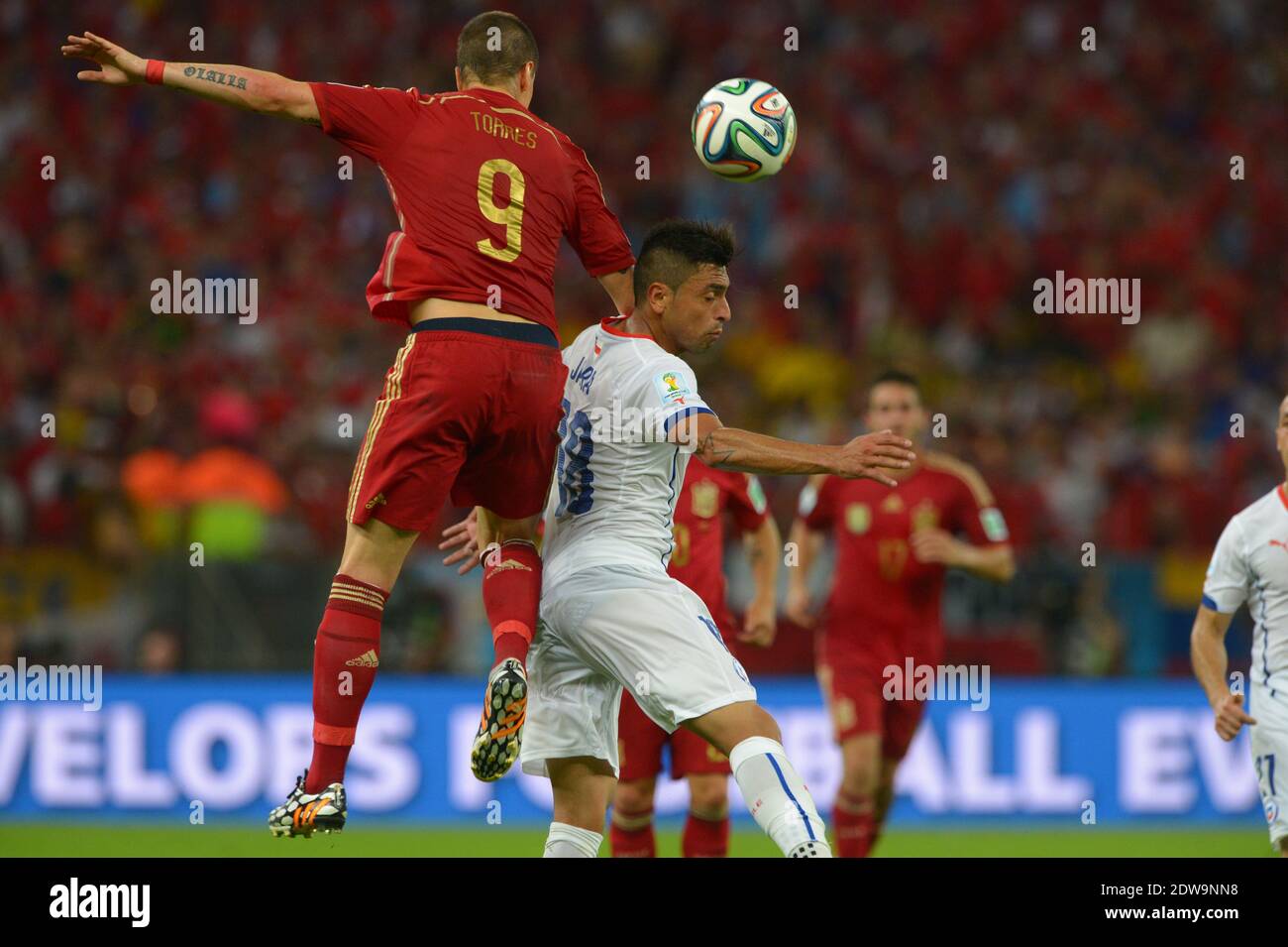 Spain's Fernando Torres battling Chile's Gonzalo Jara during Soccer World Cup 2014 First round Group B match Spain v Chile at Maracana Stadium, Rio de Janeiro, Brazil , on June 18, 2014. Chile won 2-0 and ousted the defending champions from the competition. Photo by Henri Szwarc/ABACAPRESS.COM Stock Photo