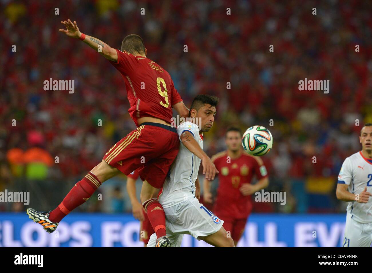 Spain's Fernando Torres battling Chile's Gonzalo Jara during Soccer World Cup 2014 First round Group B match Spain v Chile at Maracana Stadium, Rio de Janeiro, Brazil , on June 18, 2014. Chile won 2-0 and ousted the defending champions from the competition. Photo by Henri Szwarc/ABACAPRESS.COM Stock Photo