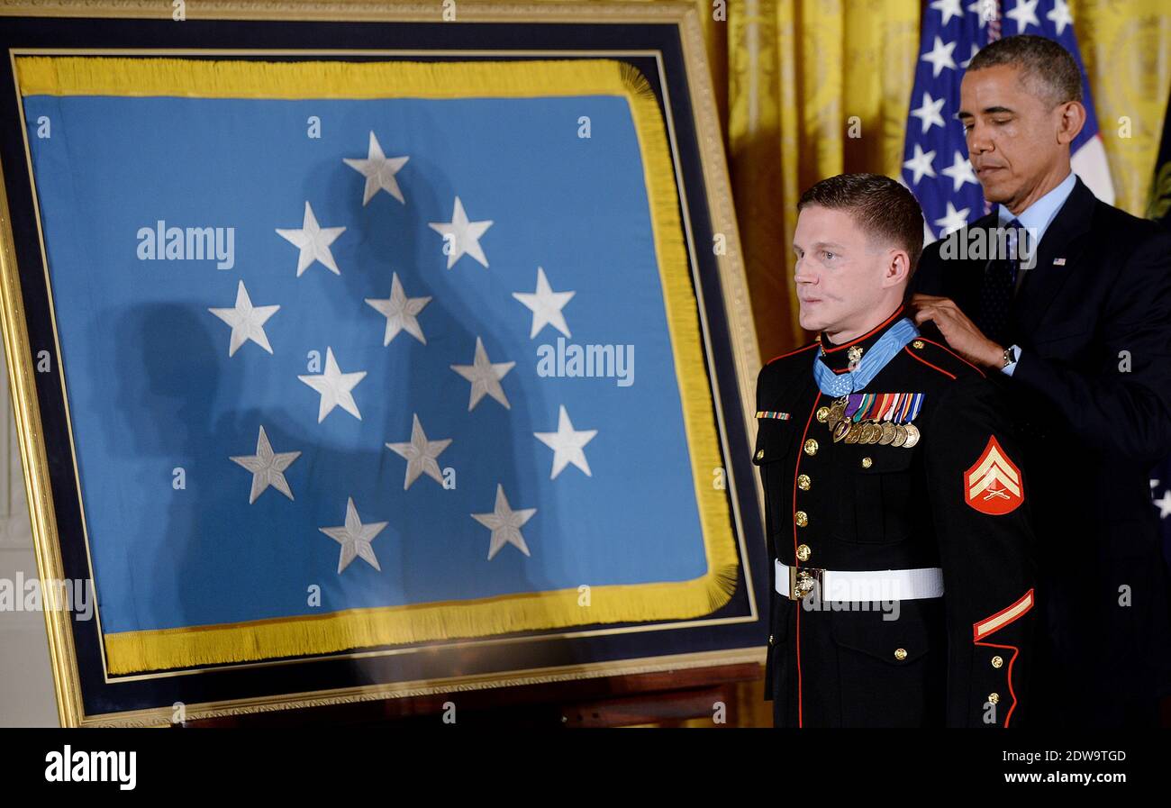 President Barack Obama awards Corporal William 'Kyle' Carpenter, U.S. Marine Corps (Ret.), the Medal of Honor for conspicuous gallantry in the East Room of the White House, June 19, 2014 in Washington, DC, USA. Photo by Olivier Douliery/ABACAPRESS.COM Stock Photo
