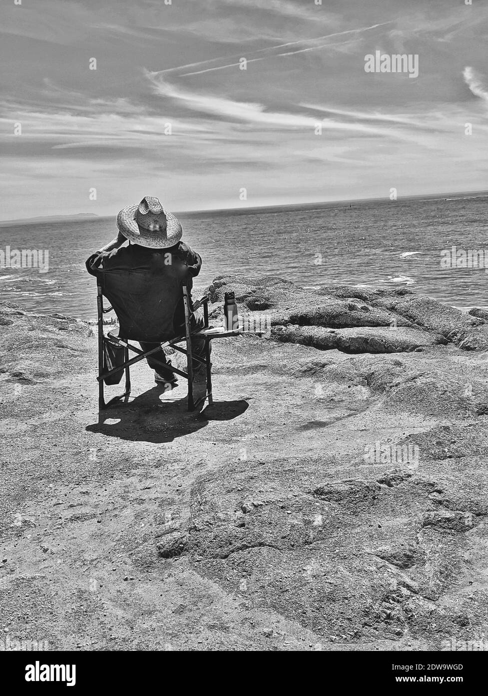 Man sitting on beach chair Black and White Stock Photos & Images Alamy