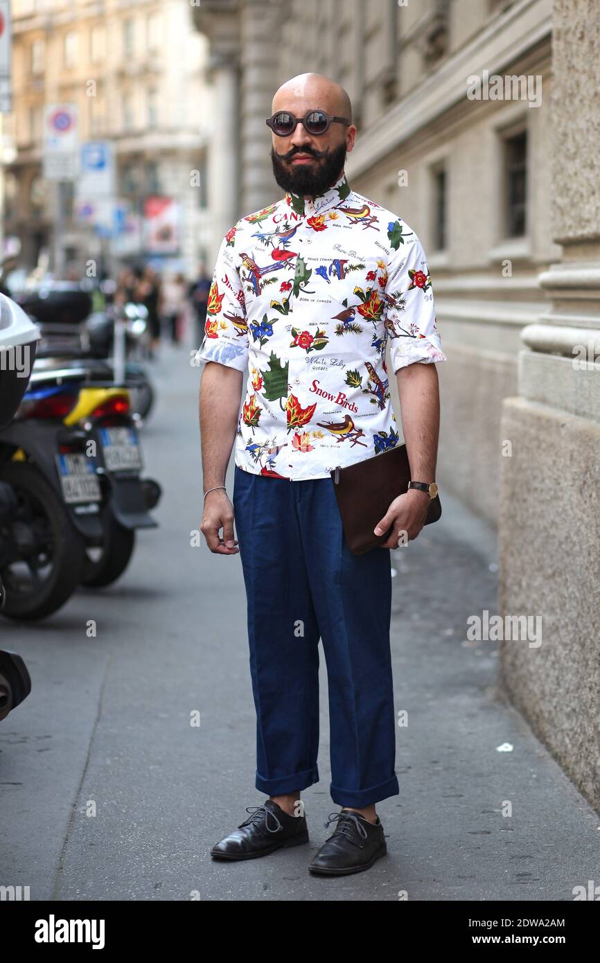 Salvo Presti arriving at Salvatore Ferragamo Spring-Summer 2015 menswear  show held at Piazza Affari, Milan, Italy on June 22nd, 2014. He is wearing  Dsquared shirt, vintage pants and shoes, Gucci bag. Photo