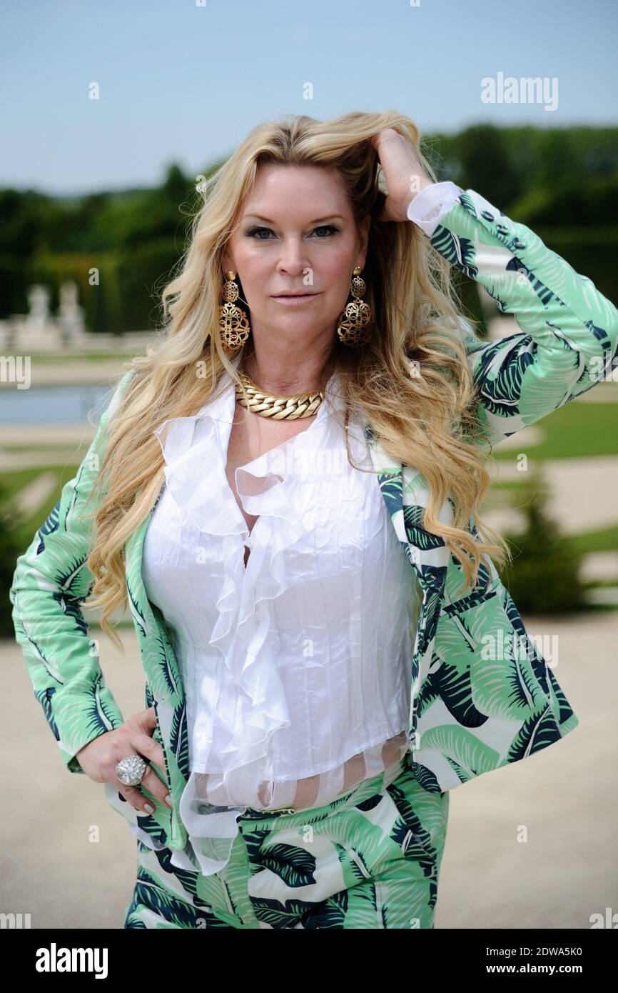 Exclusive - Jackie Siegel poses at the Chateau de Versailles, near Paris, France, on June 23, 2014. You may not have heard of Jackie Siegel, but chances are you’ve heard about the mega-house she and her husband are building. The Florida-based Siegel, 48, and her 78-year-old husband, David, were portrayed in the documentary The Queen of Versailles, which won an award for directing at the 2012 Sundance Festival. Billed as the largest residence in America at 90,000 square feet, it has 30 bedrooms and 23 bathrooms. The building of the home was stalled for three years as David’s time-share company, Stock Photo