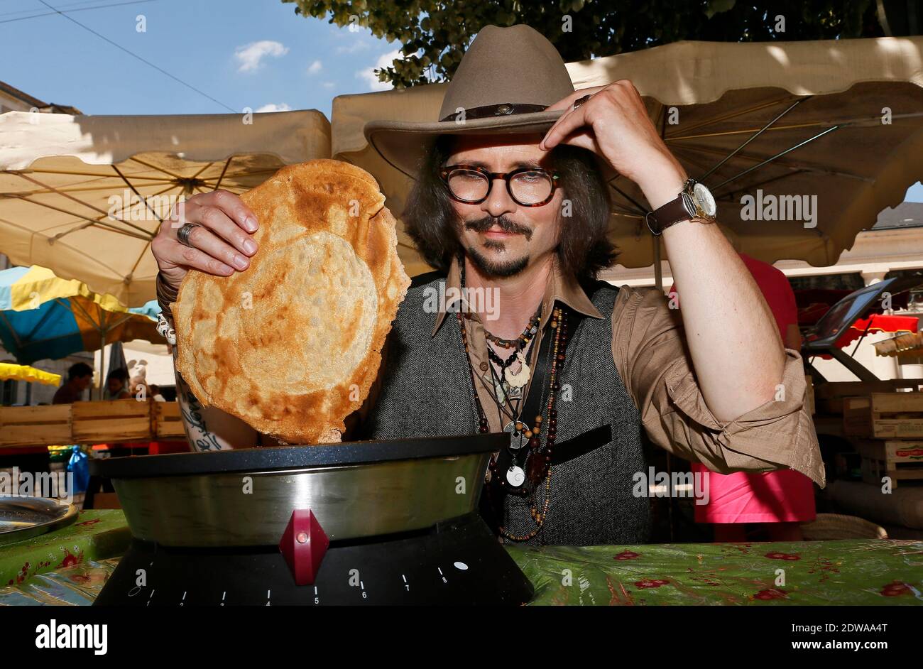 Exclusive - French Johnny Depp look-alike, Stephane Cons, also called Johnny Steff, just launched a new culinary activity in the South of France. In many different regional local markets, and especially in Perigueux, Cons runs a Crepes (pancakes) stand under the brand name 'Johnny Crepp'. For a year now, this former plants seller (in a garden center) changed his life to become the French Depp's look-a-like. Similar to Johnny Depp, Stephane Cons, 46, decided to make competitions, to audition roles, etc.. After some time, Cons figured out that he was the only official Depp's sosie in France. Joh Stock Photo