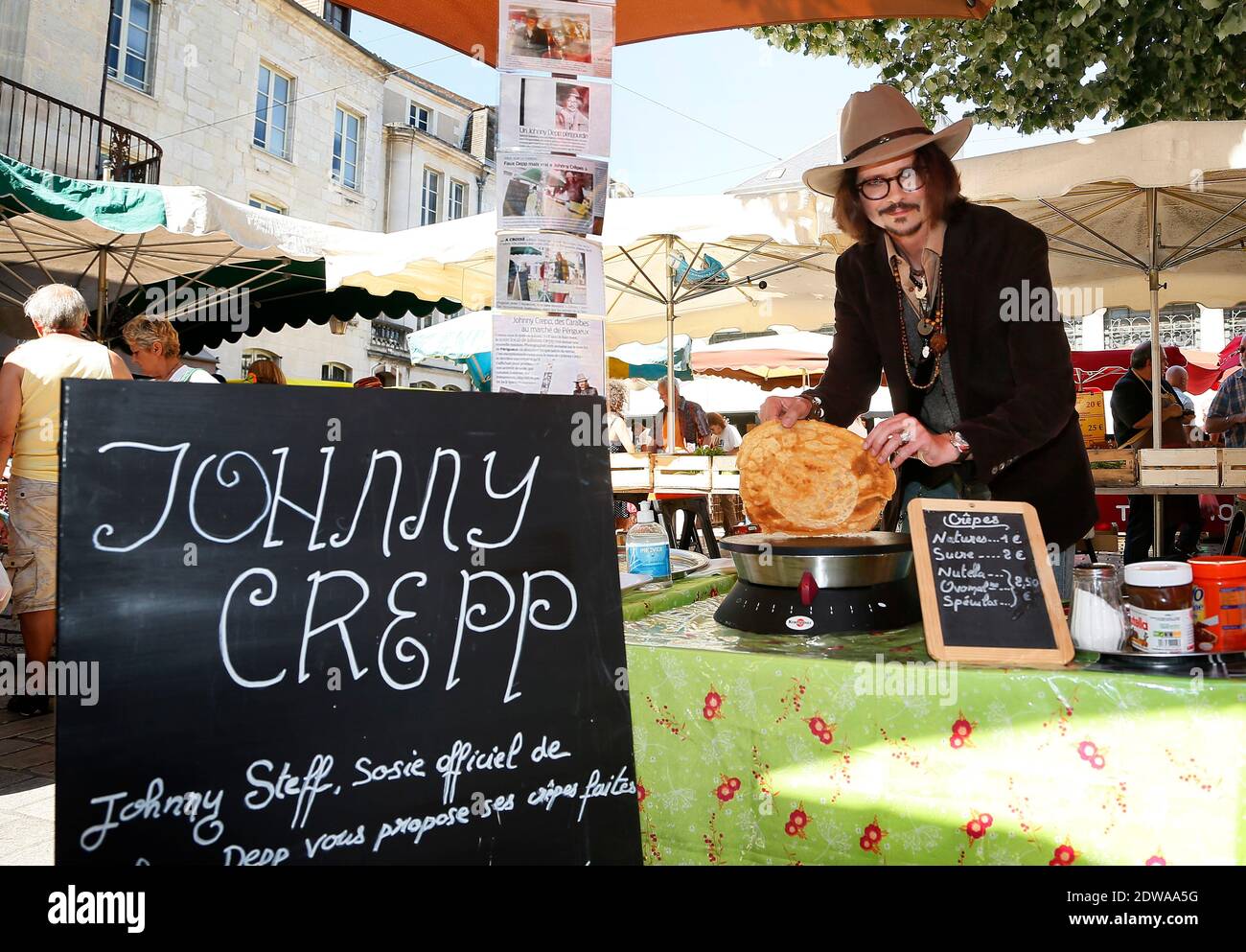 Exclusive - French Johnny Depp look-alike, Stephane Cons, also called Johnny Steff, just launched a new culinary activity in the South of France. In many different regional local markets, and especially in Perigueux, Cons runs a Crepes (pancakes) stand under the brand name 'Johnny Crepp'. For a year now, this former plants seller (in a garden center) changed his life to become the French Depp's look-a-like. Similar to Johnny Depp, Stephane Cons, 46, decided to make competitions, to audition roles, etc.. After some time, Cons figured out that he was the only official Depp's sosie in France. Joh Stock Photo