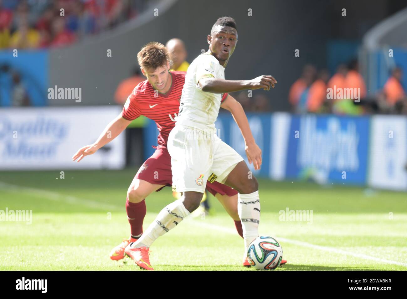 Ghana's Abdul Majeed Waris battling Portugal's Miguel Veloso during Soccer World Cup 2014 First round Group G match Ghana v Portugal at National Stadium, Brasilia, Brazil on June 26, 2014. Portugal won 2-1. Photo by Henri Szwarc/ABACAPRESS.COM Stock Photo