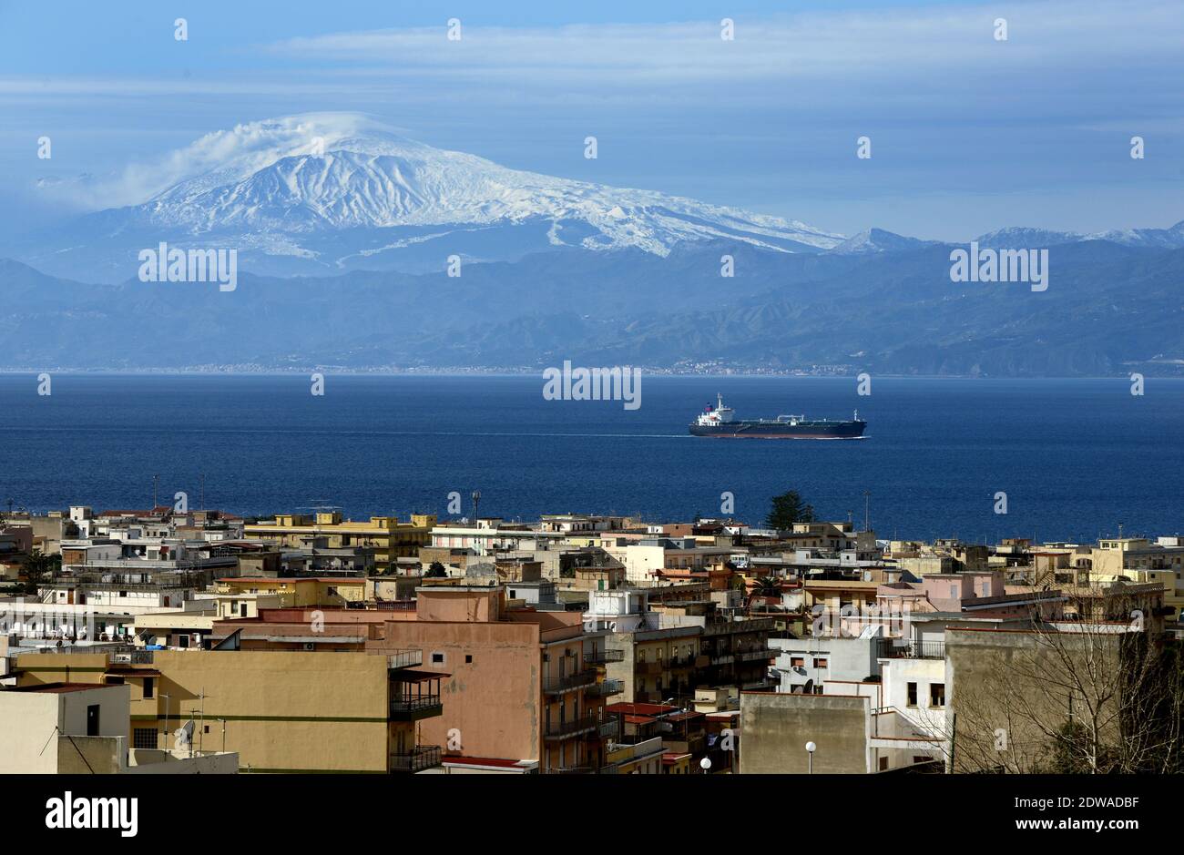 A view of Reggio Calabria, the main city of Calabria. On the other side of  the sea , the Mount Etna in Sicily.The town of San Luca, South of Italy on  February