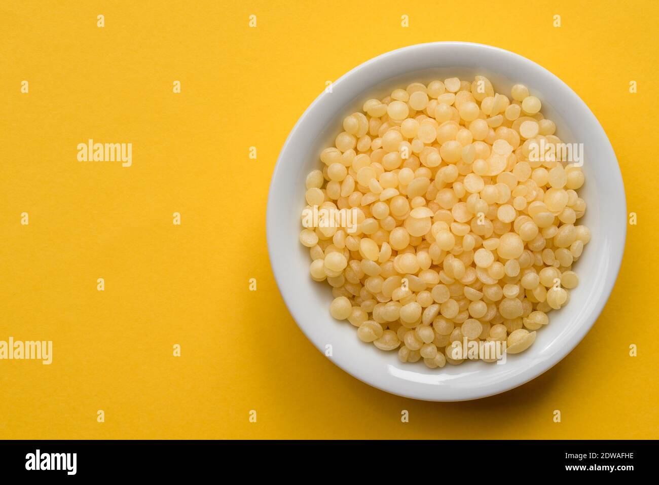 Bees Wax Pellets in a Bowl Stock Photo