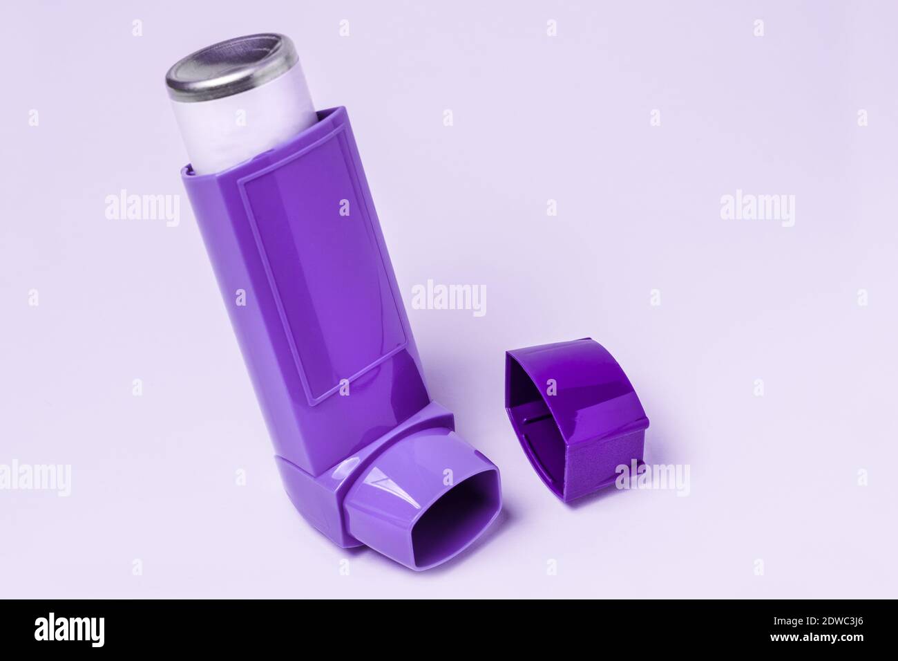 Purple Asthma Inhaler Against White Background Stock Photo Alamy