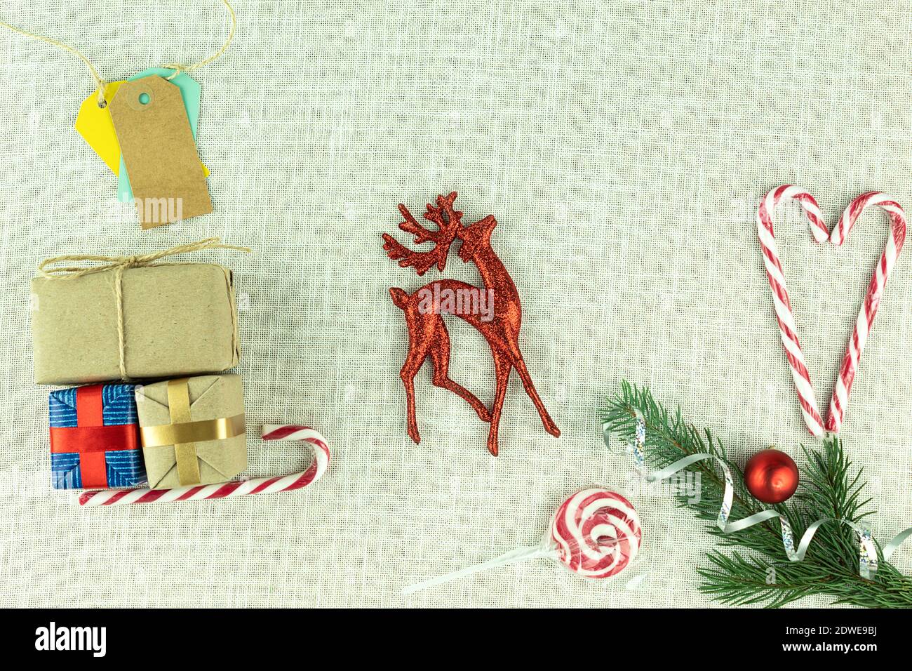 Christmas background on fabric with a deer and sleigh and gifts