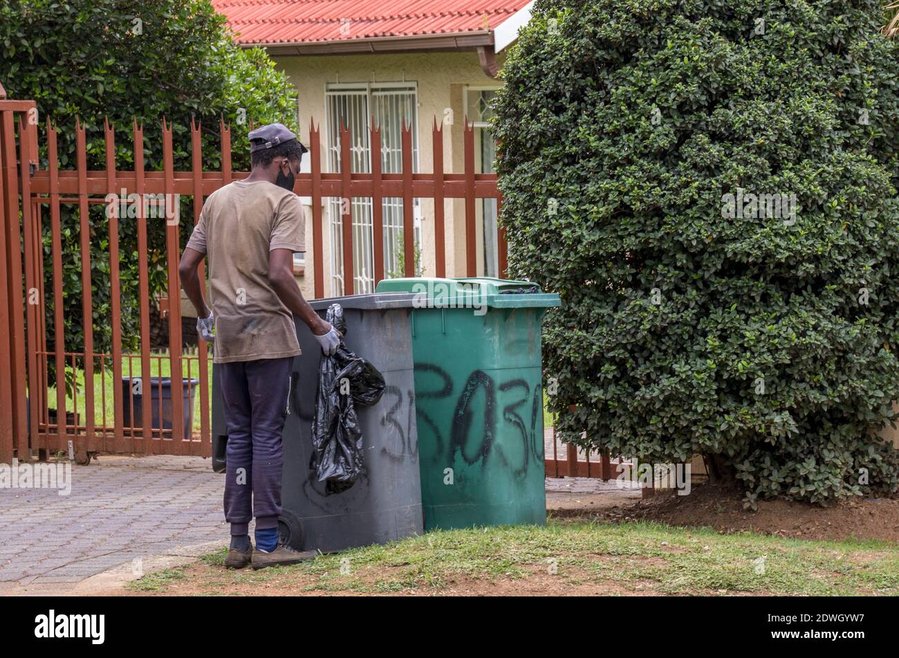 Johannesburg, South Africa dustbin diving to salvage plastic, food