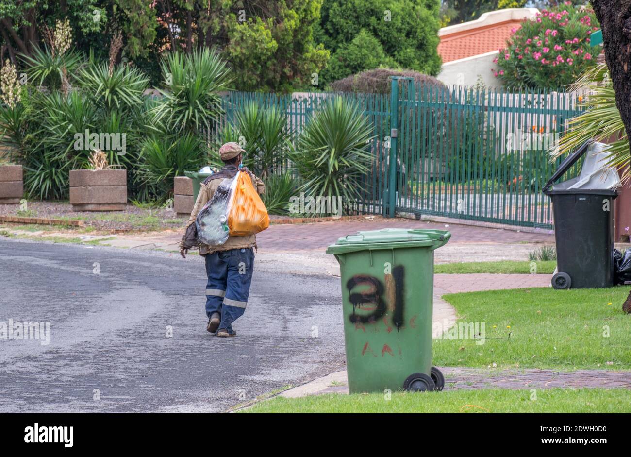 Johannesburg, South Africa dustbin diving to salvage plastic, food