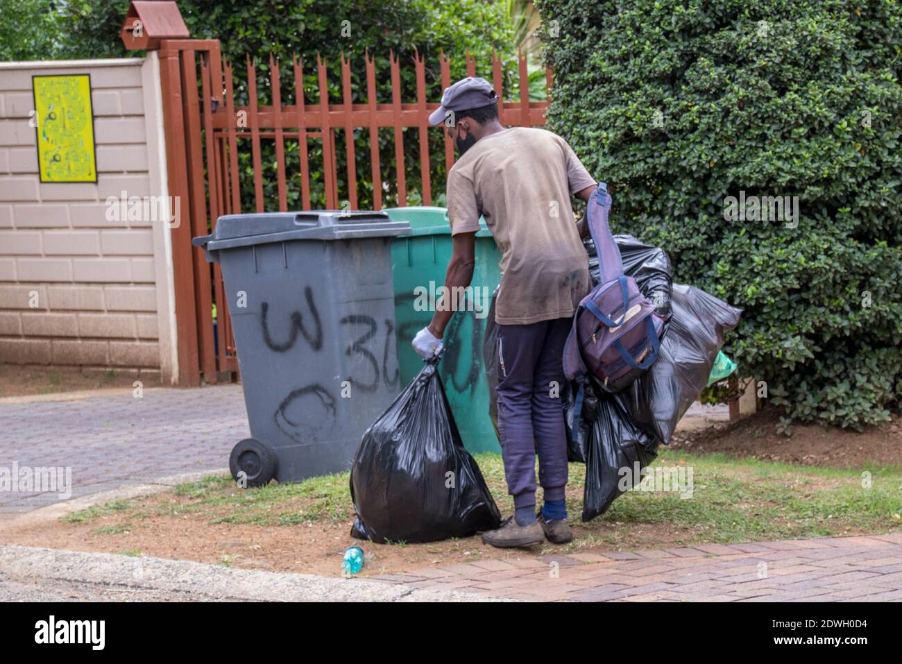 Johannesburg, South Africa dustbin diving to salvage plastic, food