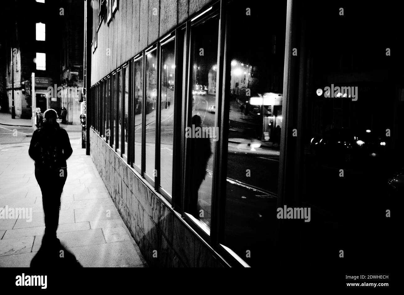 Black and white man walking on sidewalk Black and White Stock Photos ...