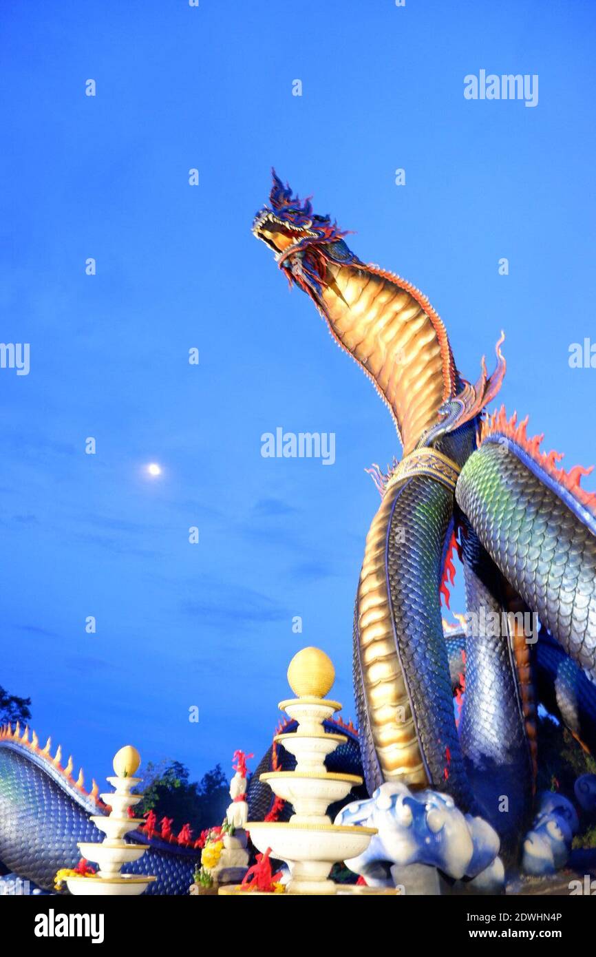 Low Angle View Of Chinese Dragon Against Blue Sky Stock Photo