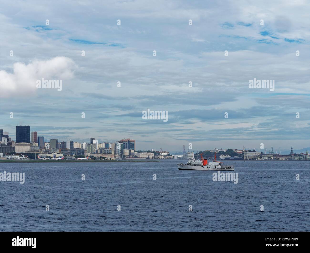 the Japanese Navy Oceanographic Survey Vessel Sirius anchored in the bay of Rio Old Port in front of the Santos Dumont Airport in December. Stock Photo