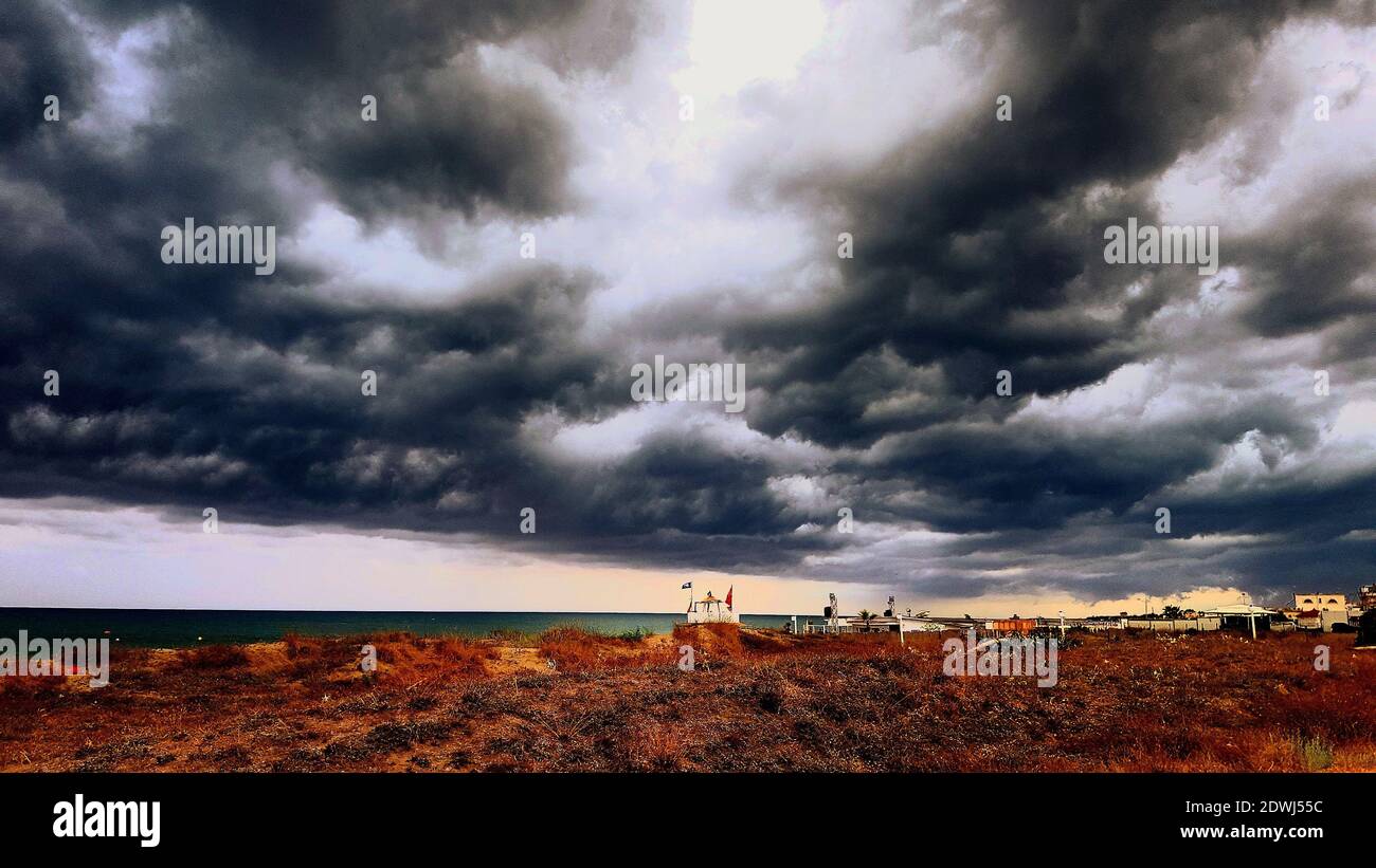 Storm Clouds Over Land Stock Photo Alamy