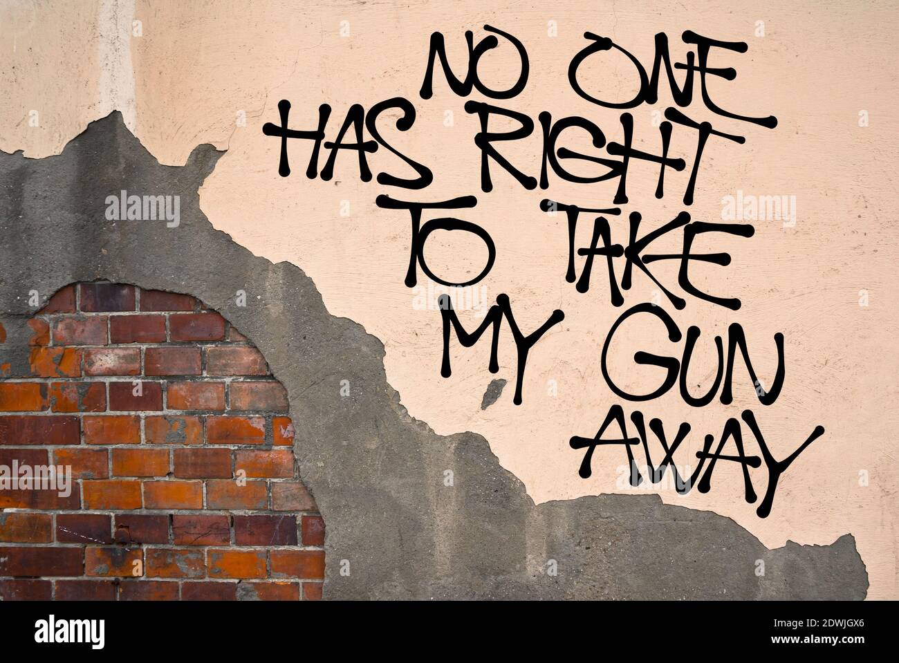No One Has Right To Take My Gun Away - handwritten graffiti sprayed on the wall - fight against gun control and legislative restriction. Appeal to pre Stock Photo