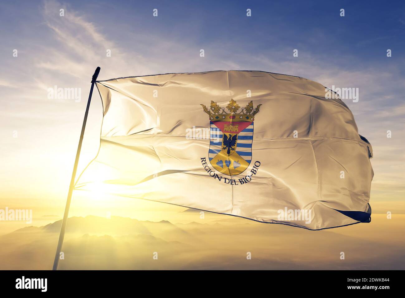 Bio Bio region of Chile flag waving on the top sunrise mist fog Stock Photo