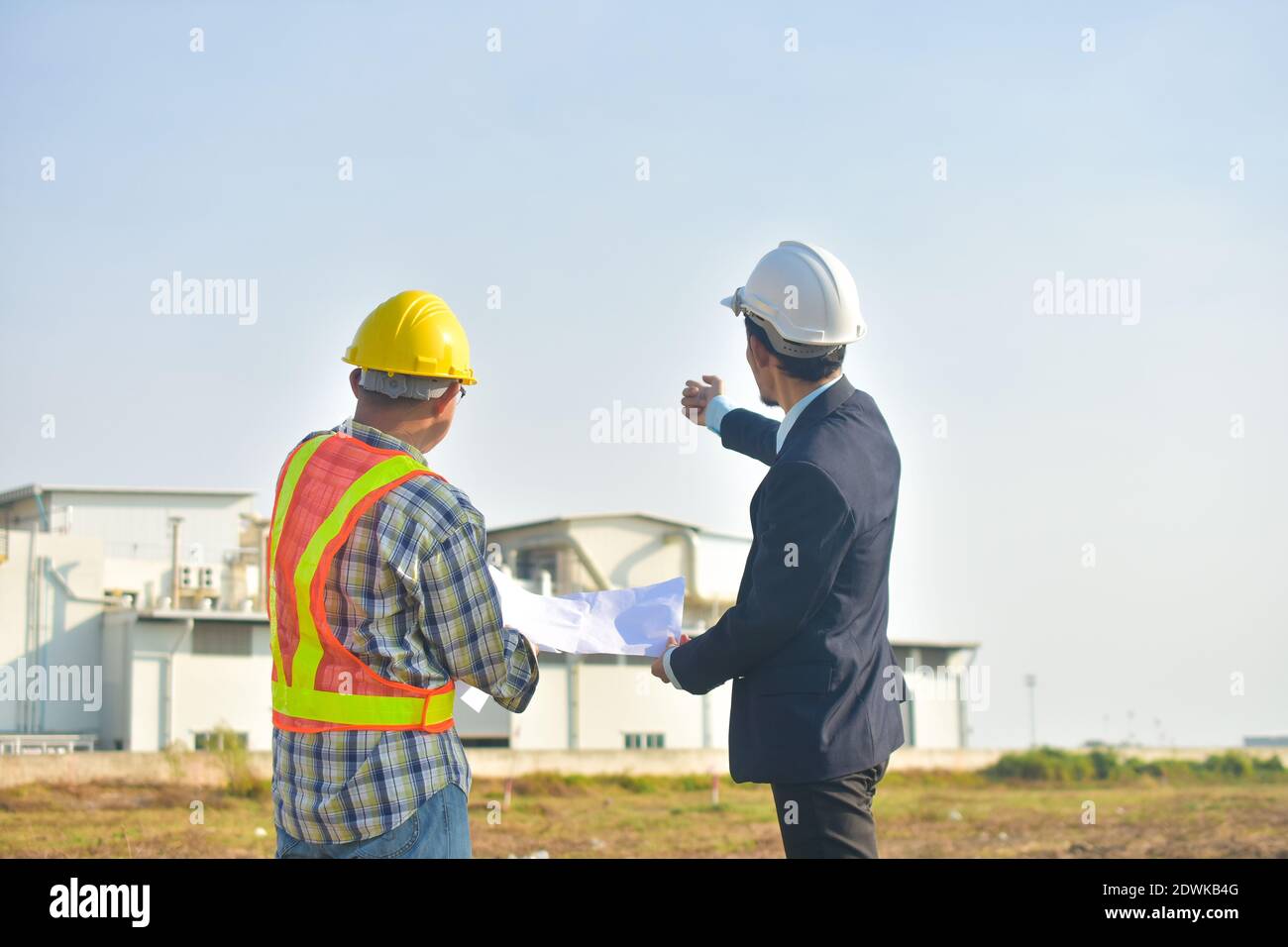 Project Manager taking with Engineer construction plan project building ...