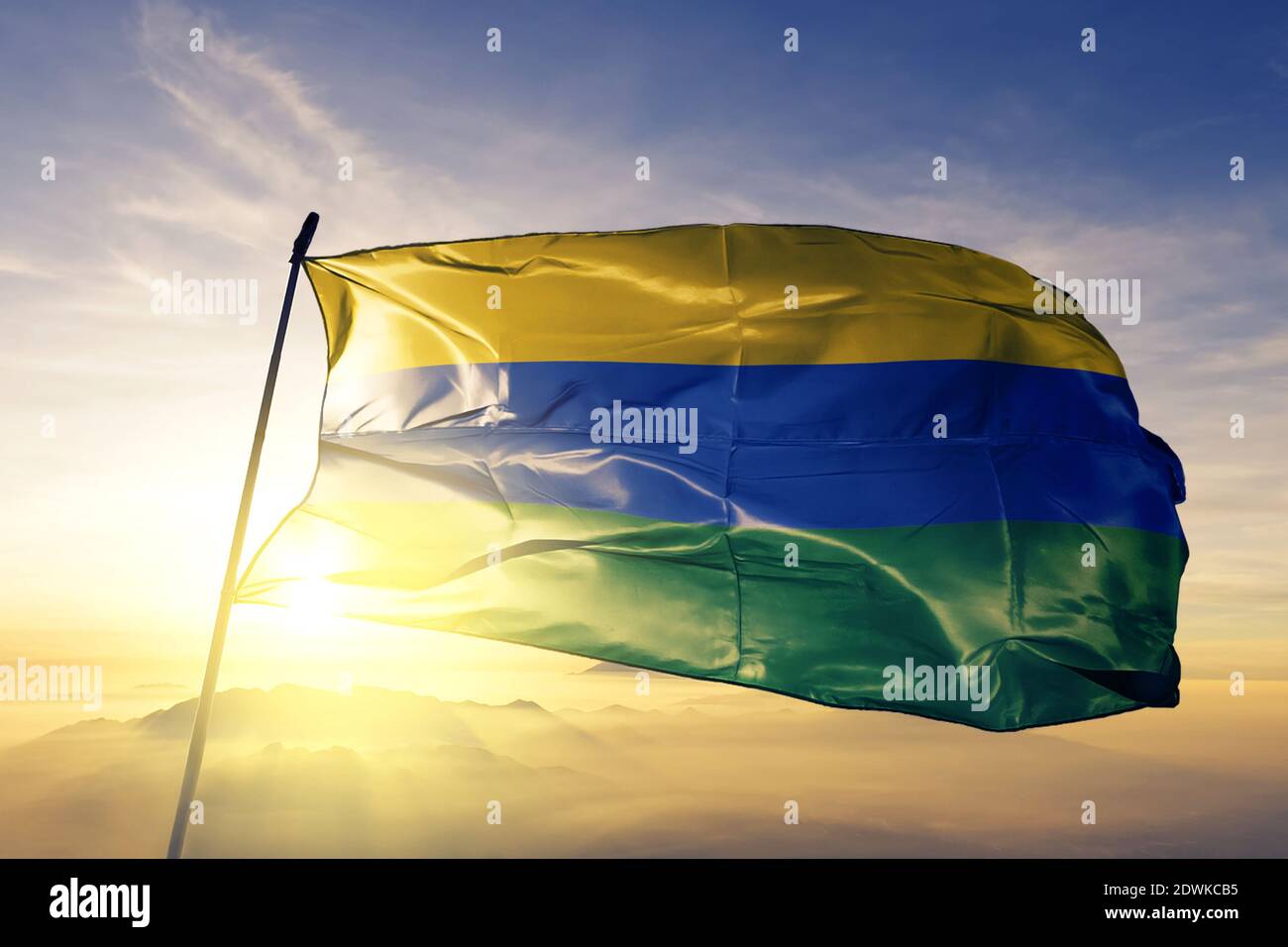 Guainia department of Colombia flag waving on the top sunrise mist fog Stock Photo