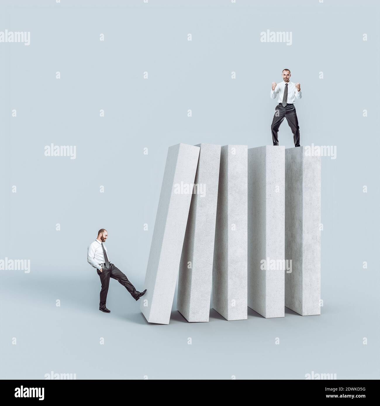 man tries to drop his colleague from the blocks. concept of dissatisfaction, envy, unfair competition. Stock Photo