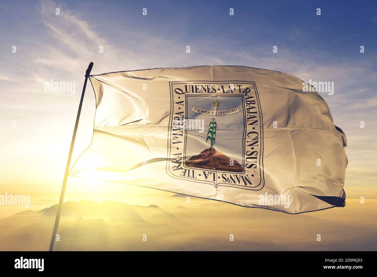 Morelos state of Mexico flag waving on the top sunrise mist fog Stock
