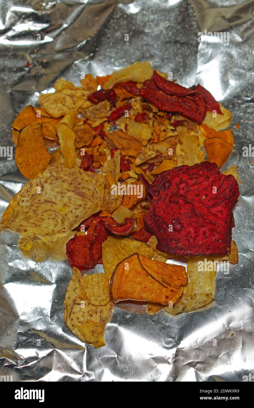 Natural vegetables and potato chips mix baked in foil Stock Photo Alamy