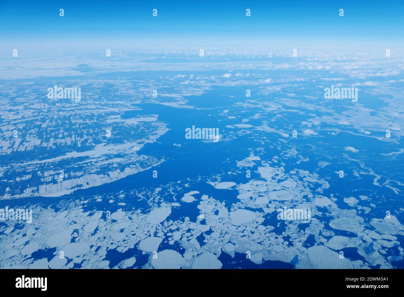 Aerial View Of Snowcapped Landscape Against Sky Stock Photo
